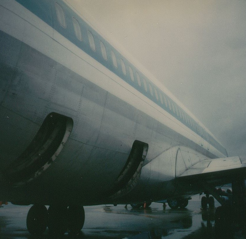 Pan Am Boeing 707 tail number N427PA Clipper Crystal Palace seen from rear on a rainy day, Washington Dulles ramp January 2, 1979.